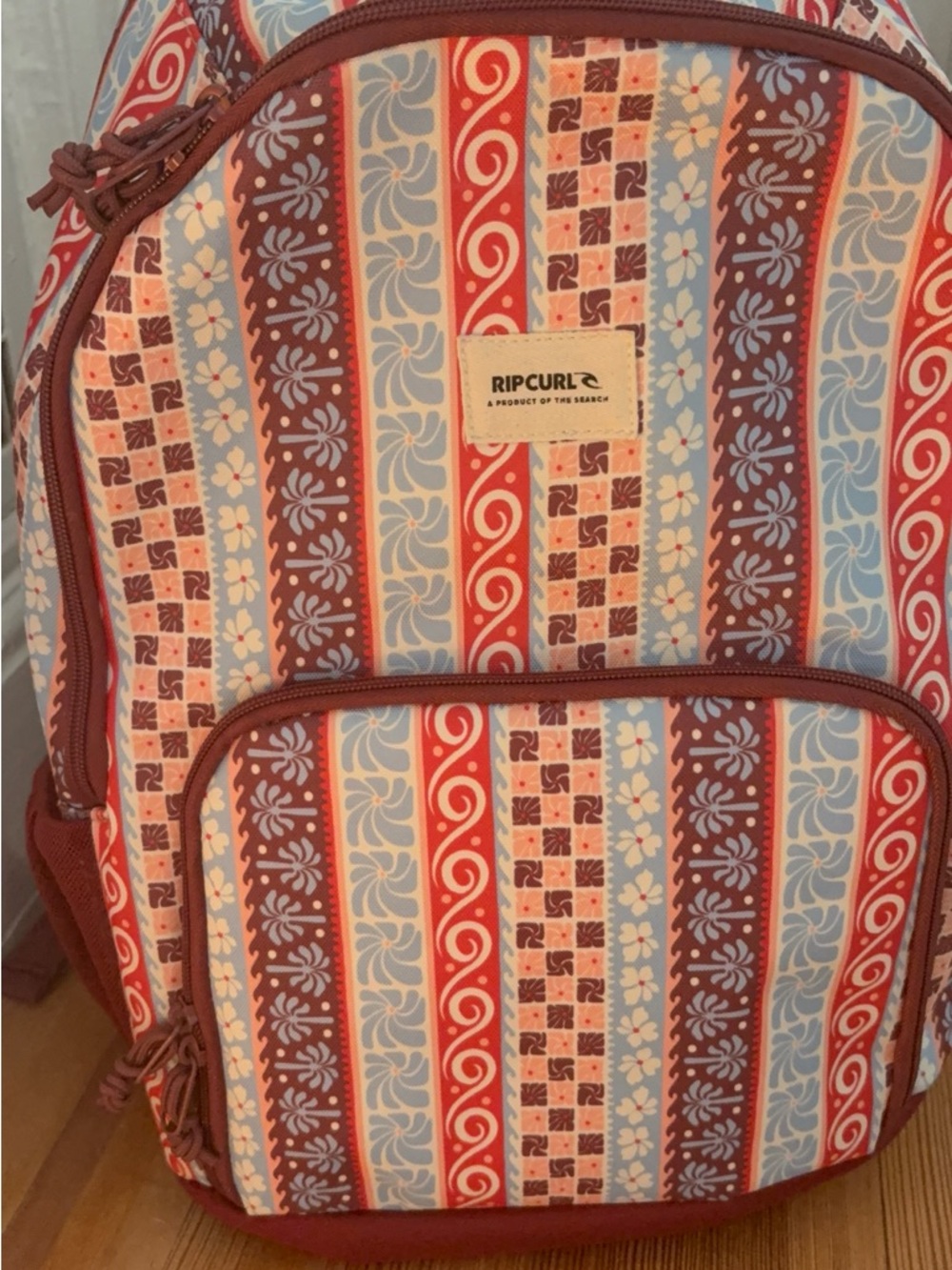Rip Curl Striped Floral Pattern Backpack in Red, Blue & Brown